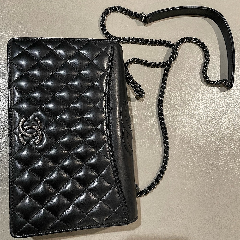 Chanel black lambskin crossbody bag.